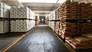 Large finished goods warehouse with stacked packaged Manganese L-Aspartate raw materials, sufficient spot inventory for global bulk export shipment