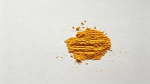 16:9 horizontal banner close-up of orange-yellow FMN-Na riboflavin phosphate sodium dihydrate powder, fine granular texture, high solubility vitamin B2 raw material for independent website product page